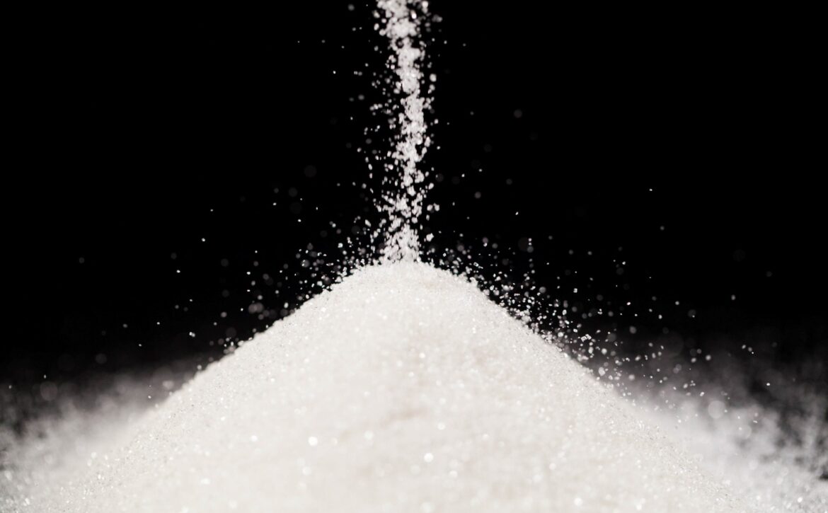 The sugar lies on the black background